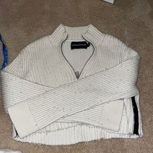 A cropped sweater that is Calvin Klein